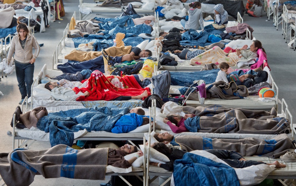Migrants at a shelter in Hanau. Refugees coming to Germany can expect shelter, a bed to sleep in and three meals a day. But for now, not much more.