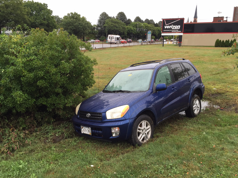 Ollie LaChapelle got trapped in her SUV in a ditch that rapidly filled with water.
Dennis Hoey/Staff Writer