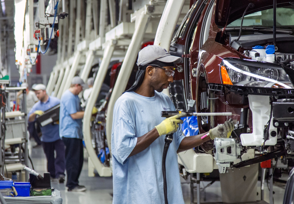 Workers at the Volkswagen plant in Chattanooga, Tenn., assemble Passat sedans. The full effect on demand for VW’s non-diesel vehicles remains to be seen, but some Tennessee officials worry about the plant that currently employs 2,400.