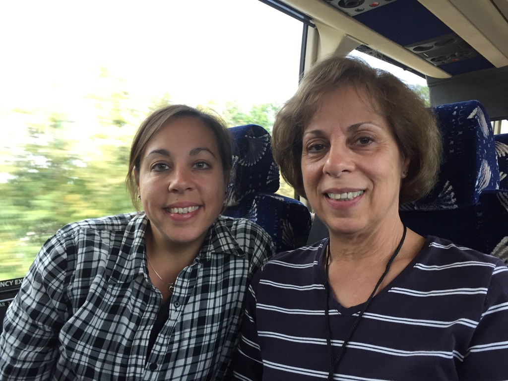 Lauren Stone of Westbrook and Lorraine Auclair of Greenville, daughter and mother, ride the bus Friday on their way to see Pope Francis this weekend in Philadelphia. "Everything is so mean and scary in the world," Stone said, "and Pope Francis is so kind and caring."
