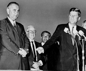 U.S. President John F. Kennedy, right, turns to introduce Vice President Lyndon B. Johnson to the crowd gathered to welcome the president and his party at Houston International Airport, Texas, on Sept. 11, 1962. The Associated Press