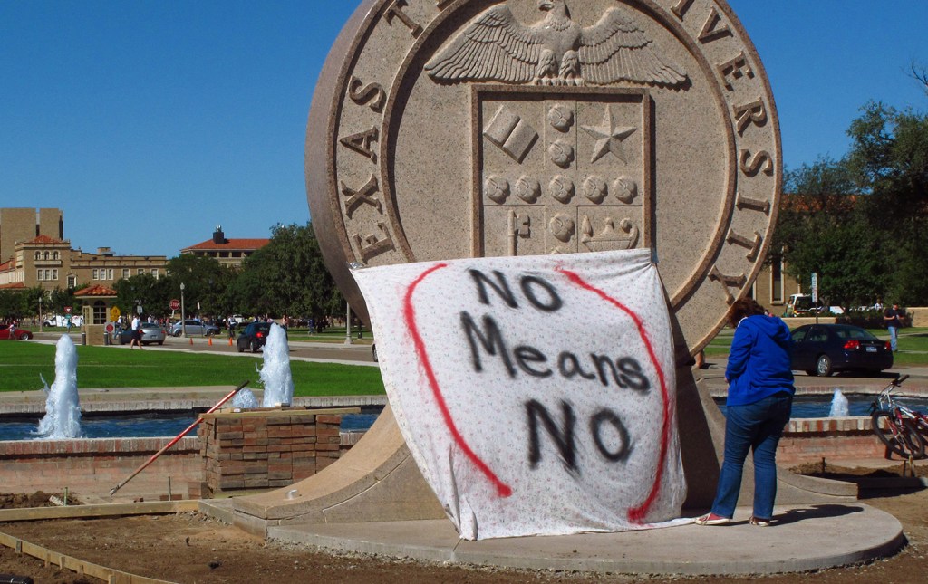 A Texas Tech student helps drape a bed sheet with the message "No Means No" over the university's seal at the Lubbock campus to protest what students say is a "rape culture" on campus. In a survey of two dozen American universities, one-quarter of the undergraduate women said they had experienced unwanted sexual contact while at college. 