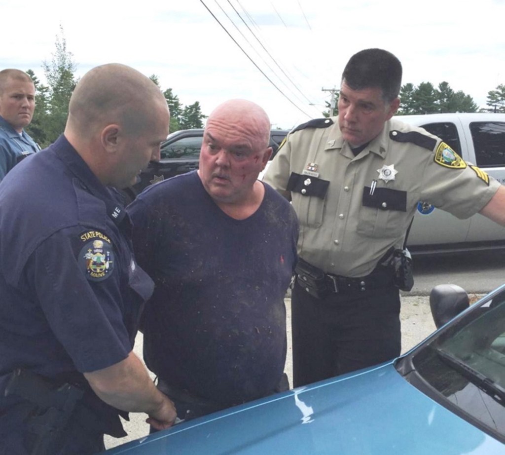  John J. Gagnon, 56, is taken into custody by state police following a crash on Leighton Road in Augusta. 