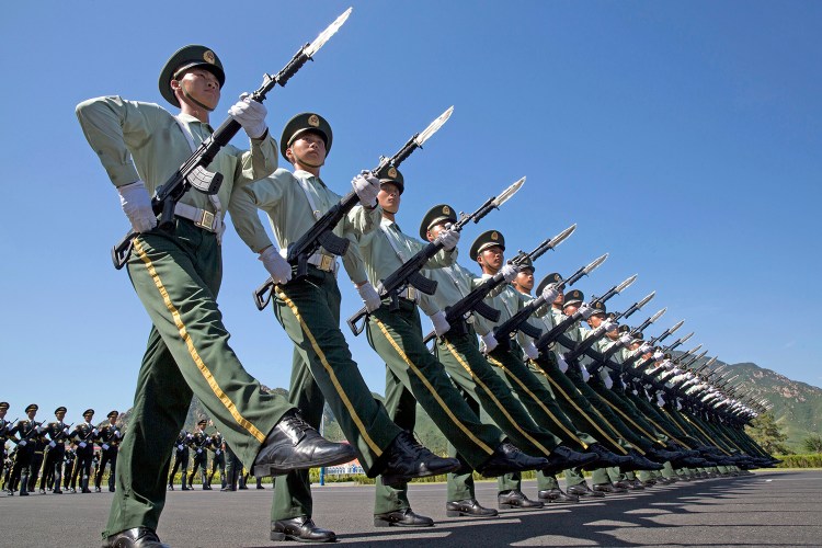 Chinese troops practice marching ahead of  Thursday's military parade at a camp on the outskirts of Beijing. The Associated Press