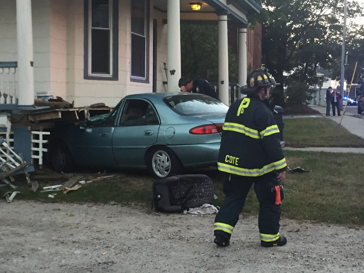 One person was taken to a hospital after this car crashed into the house at 234 Woodford St. in Portland on Wednesday.