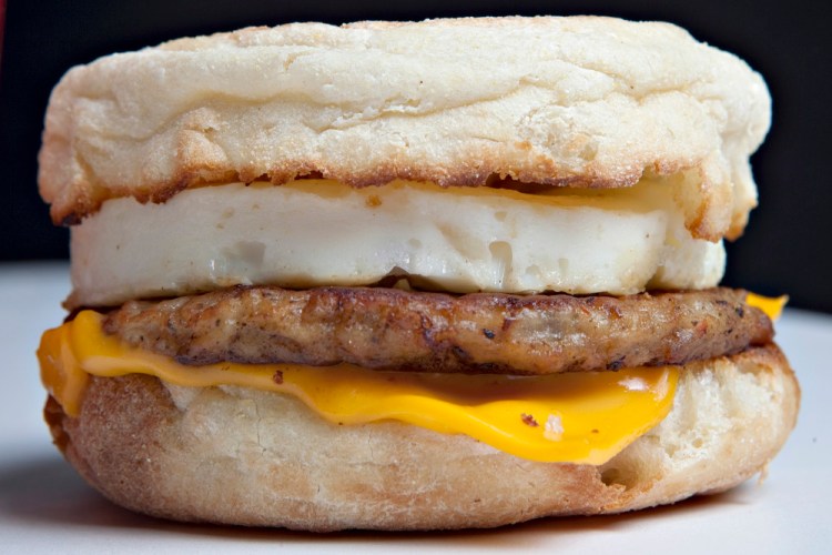 A McDonald's Sausage McMuffin with egg. Breakfast sandwiches like this possess a long and surprising history.