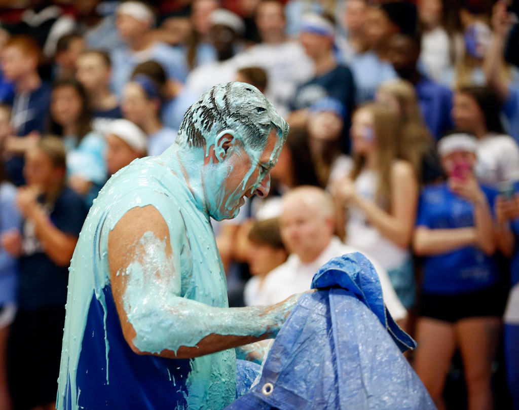 Westbrook High School Principal Jon Ross walks out of the gymnasium after getting slimed during an annual pep rally at the school Wednesday. (Derek Davis/Staff Photographer)