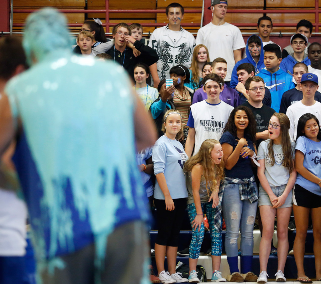 Westbrook High School students react after Principal Jon Ross got slimed during an annual pep rally at the school. Students collected money to benefit the Latin Club. (Derek Davis/Staff Photographer)