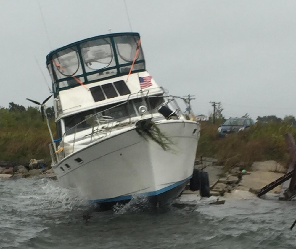 This Bayliner washed ashore at Bug Light in South Portland on Wednesday.