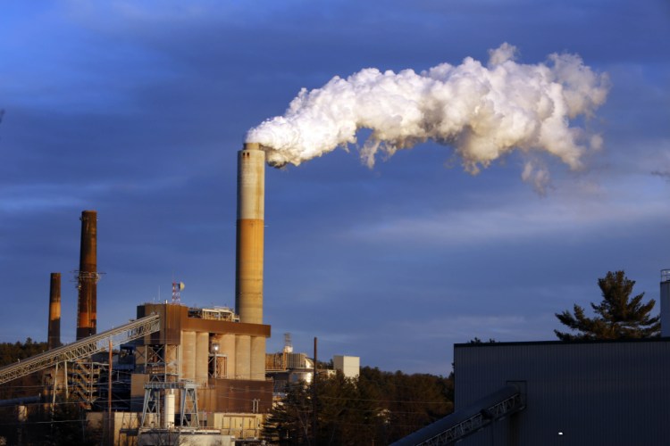 A plume of steam billows from the coal-fired Merrimack Station in Bow, N.H., in January. Environmentalists say that new EPA standards fall far short of what public health experts had recommended.