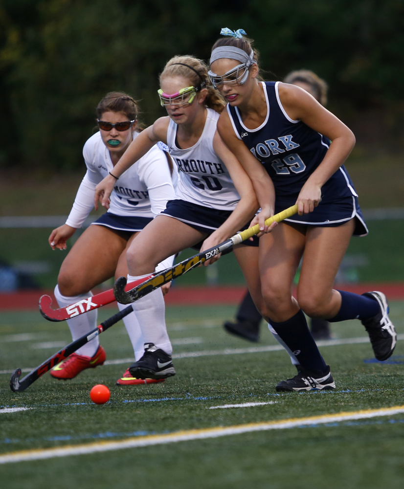 Lily Posternak, a junior who recently verbally committed to play field hockey at Duke, pushes the ball down the field Thursday for York during a 1-0 victory against Yarmouth.