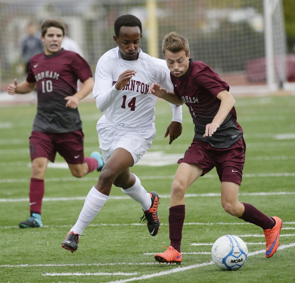 Ethan Orach of Gorham attempts to keep the ball away from Edwin Kayumba of Thornton Academy during Thornton’s 3-2 victory Thursday. The game matched two undefeated SMAA boys’ soccer teams.