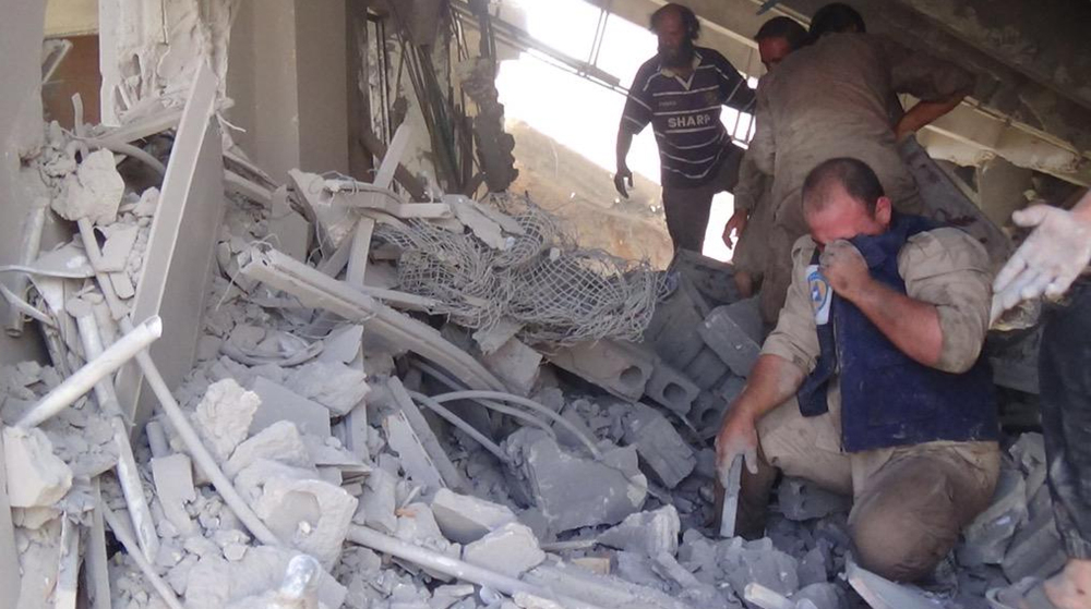 A volunteer search and rescue group shows the aftermath of an airstrike in Talbiseh, Syria, on Wednesday, when Russia carried out its first airstrikes in Syria.