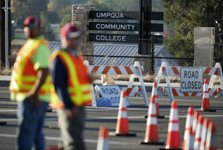 Authorities block a road leading to the Umpqua Community College on Friday in Roseburg, Ore.