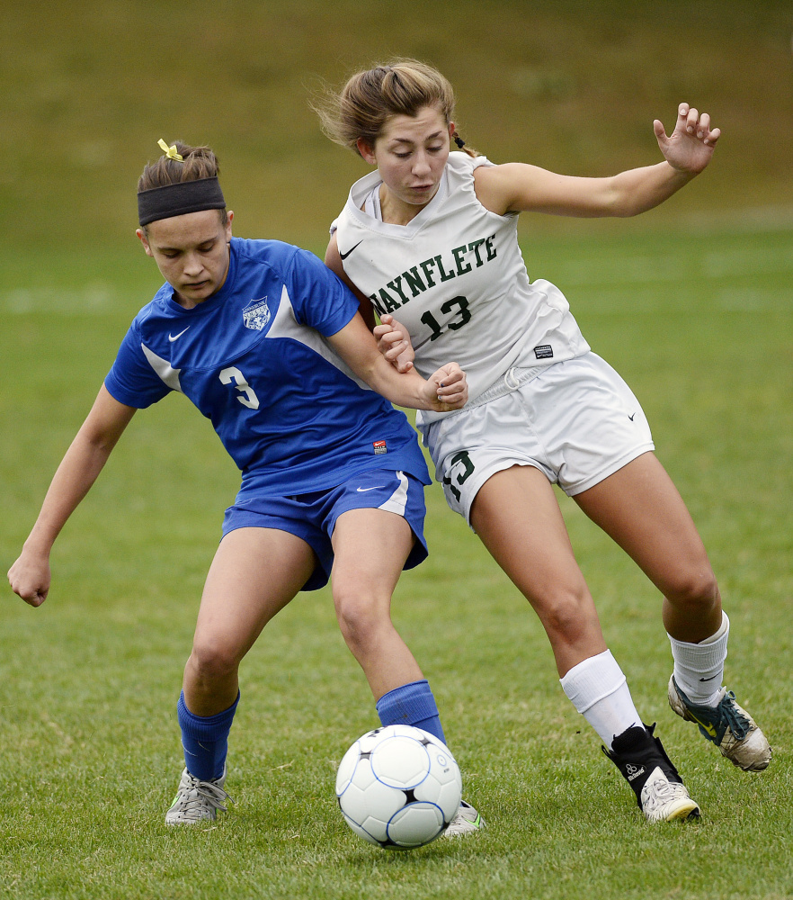 Sarah Thill of Kennebunk, left, who assisted on the only goal of the game, attempts to keep the ball from Amelia Bertaska of Waynflete. Kennebunk improved to 3-4-2 and dropped the Flyers to 7-2.