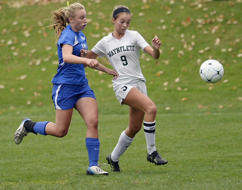 Esme Benson of Waynflete, right, attempts to beat Sierra Tartre of Kennebunk to the ball Friday during their Western Maine Conference girls’ soccer game at Fore River Fields in Portland. Kennebunk won, 1-0.