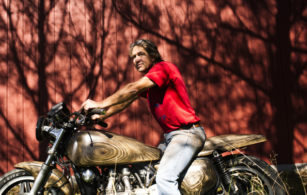 Appleton artist Stephen Gleasner sits astride his Honda Gold Wing, which he retrofitted with wooden accessories. The 53-year-old says he has an insatiable hunger to explore the next big thing. “I can’t help it,” he says.