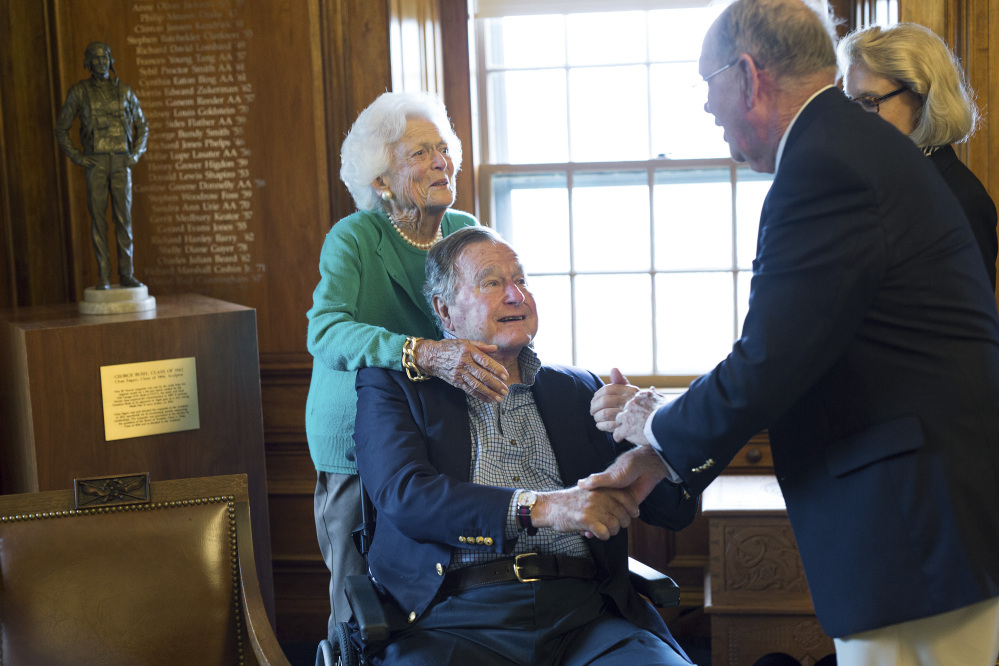 Former President George H.W. Bush, with his wife, Barbara, speaks with former baseball teammate Richard Phelps during a visit to Phillips Academy in Andover, Mass. 