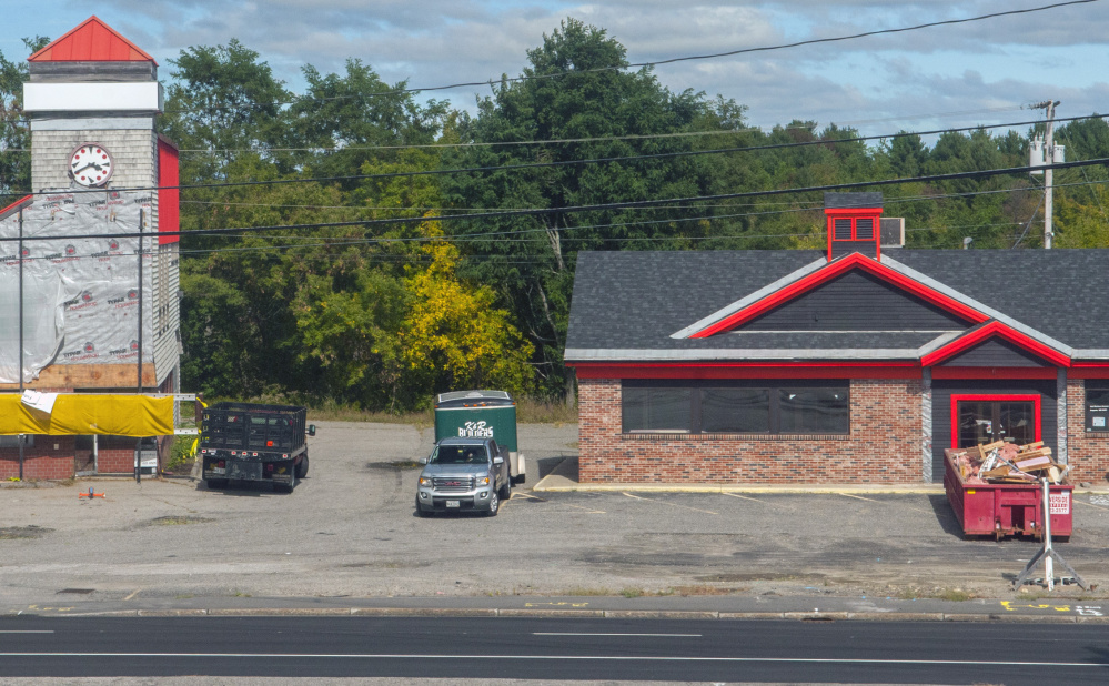 Two Western Avenue buildings are under renovation. The building on the left will become the new home for the Kennebec Valley Chamber of Commerce, and the building on the right will be a pizza shop.