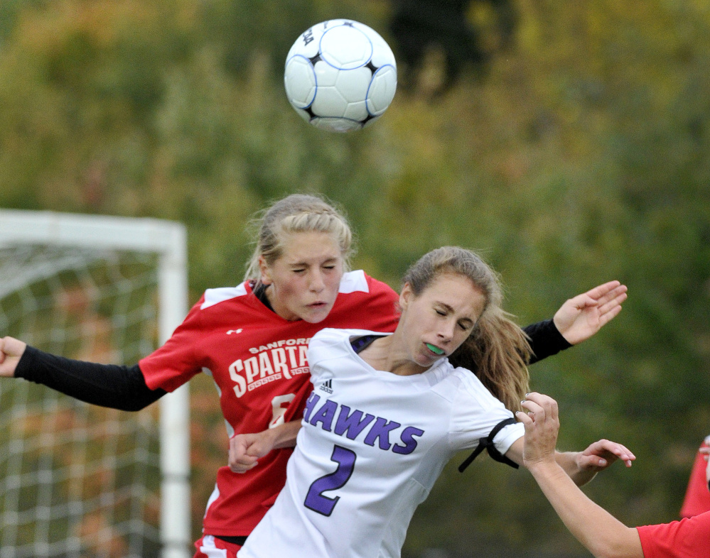 Sanford’s Megan O’Connell battles for a header with Marshwood’s Natalie DuBois, 2, during the Hawks’ 3-1 victory in a Class A South girls’ soccer game Monday in North Berwick. The Hawks improved to 7-1, while Sanford fell to 5-2-2.