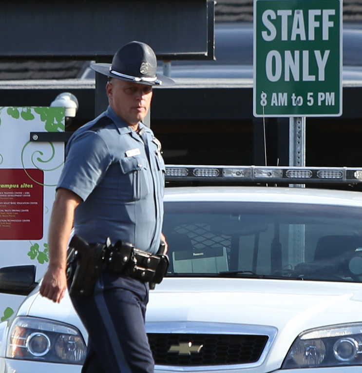 State troopers continue to be a familiar sight on the campus of Umpqua Community College near Roseburg, Ore.