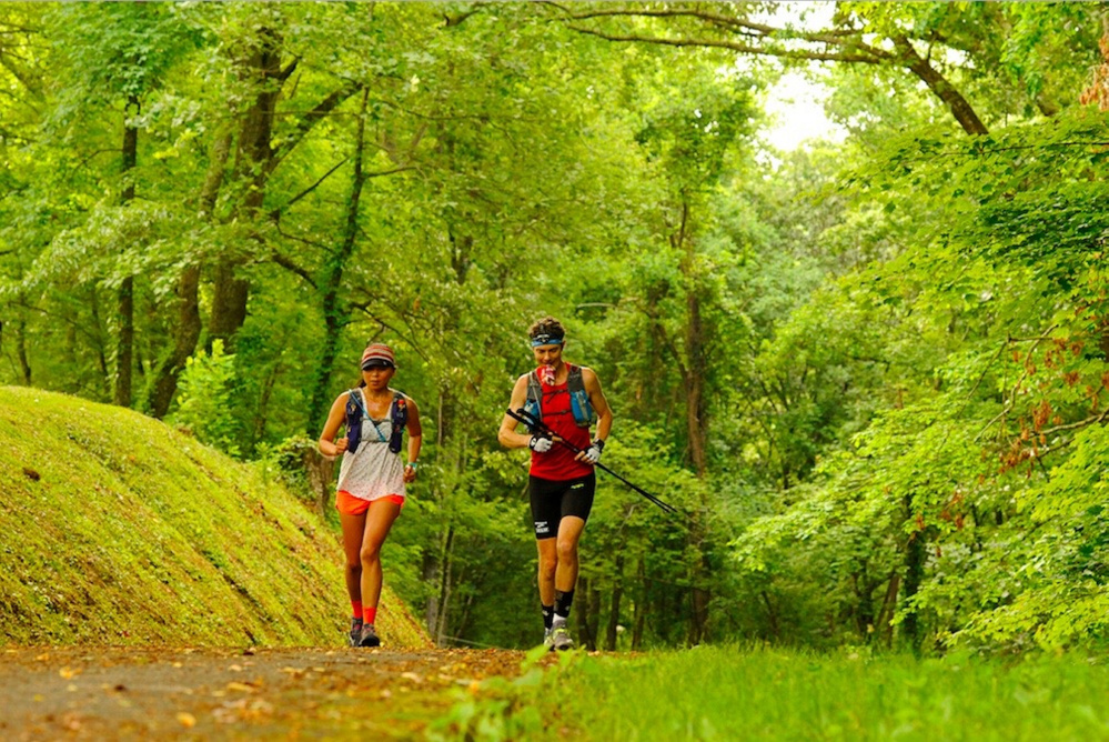Jenny and Scott Jurek run toward Fontana Dam in North Carolina on the fourth day of Scott’s record-breaking trek along the Appalachian Trail.