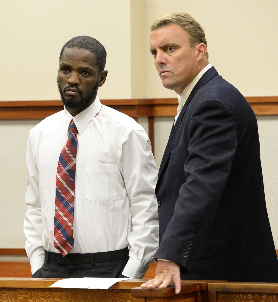 Mohamud Mohamed, left, 36, of Portland, who appeared in a Cumberland County courtroom on Tuesday, stands with his attorney Peter Cyr.