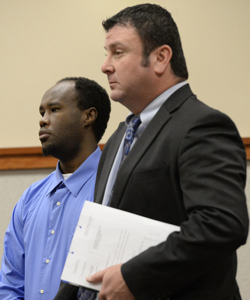 Osman Sheikh, left, 31, of Portland, pleads not guilty in the death of Freddy Akoa, at the Cumberland County Courthouse on Tuesday.