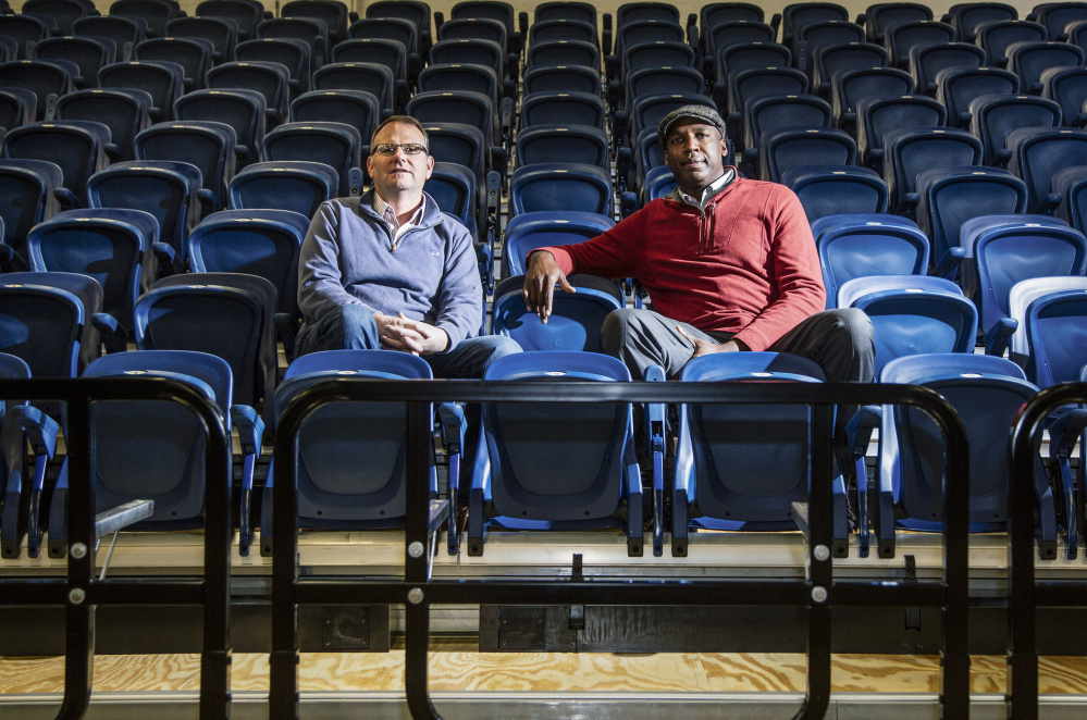Bill Ryan Jr., left, the principal owner of the Maine Red Claws, and Dajuan Eubanks, the team president, sit in the new stadium seats at the Portland Expo. The public can inspect the seats from 10 a.m. to 2 p.m. Saturday.