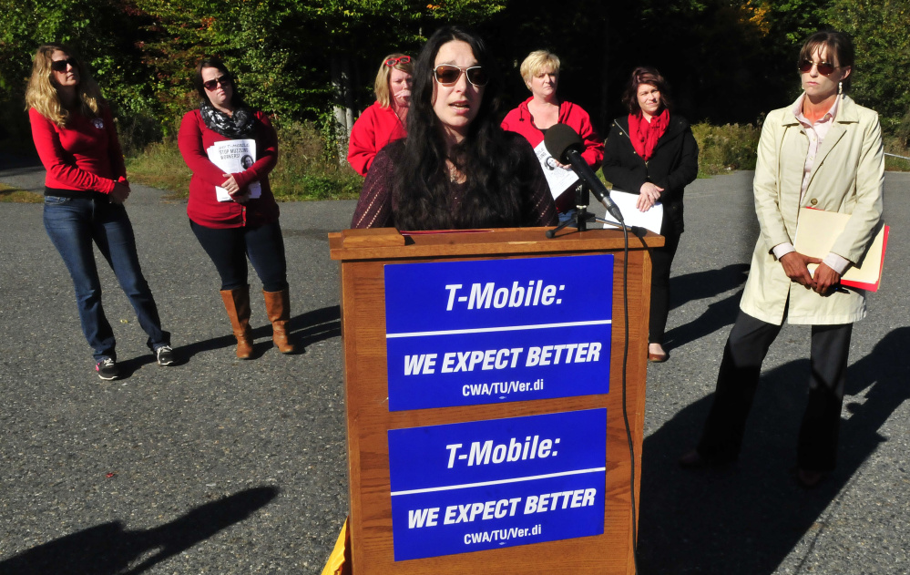 Former T-Mobile employee Angela Agganis addresses the media outside the company’s Oakland call center. She is taking the call center to court after she was told she could be fired if she didn’t sign a confidentiality agreement with the company saying she wouldn’t discuss a sexual harassment charge she had brought against her supervisor. She is surrounded by members of the Communications Workers of America union and her attorney, Allison Gray, at right.