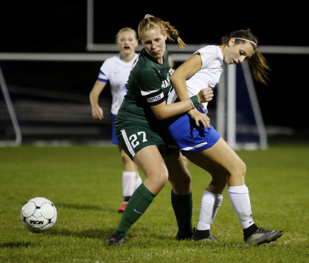 Marijke Rowse of Waynflete, left, and Courtney Ryan of Sacopee Valley battle for the ball during the first half of the Hawks’ 7-0 win Tuesday in Hiram.
Derek Davis/Staff Photographer