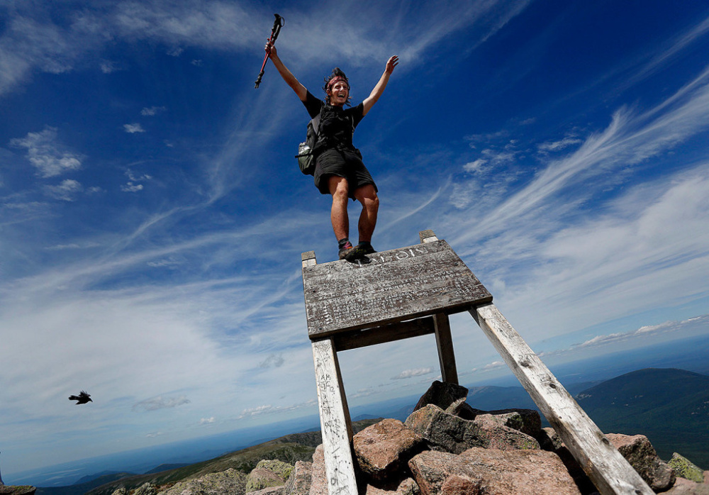 Jesse Metzler, 19, of Newton, Mass., celebrates atop Mount Katahdin after completing a hike of the Appalachian Trail on July 29. A reader who is an avid hiker and trail angel believes trail rules should be enforced.