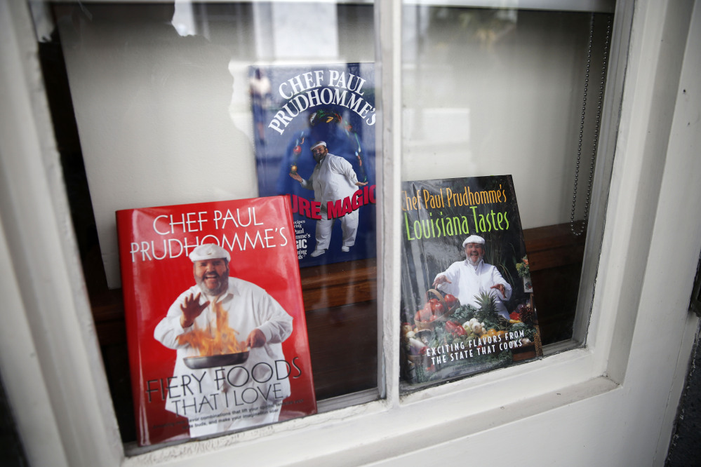 Cookbooks by Chef Paul Prudhomme are displayed in a window at K-Paul’s Louisiana Kitchen in the French Quarter of New Orleans on Thursday.
