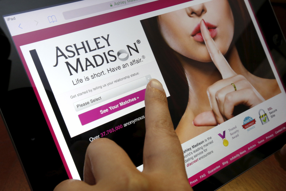 The homepage of the Ashley Madison website is displayed on an iPad. A reader says the company’s business plan is to encourage betrayal and enable deceit.