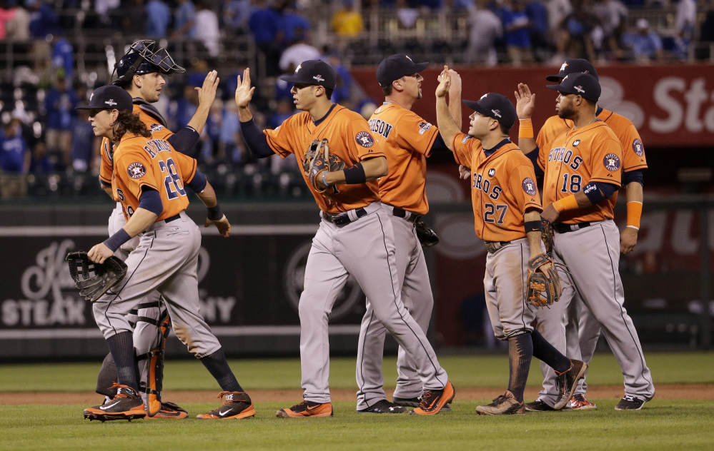 Houston players celebrate Thursday night after their victory over the Kansas City Royals in Game 1 of the American League Division Series.