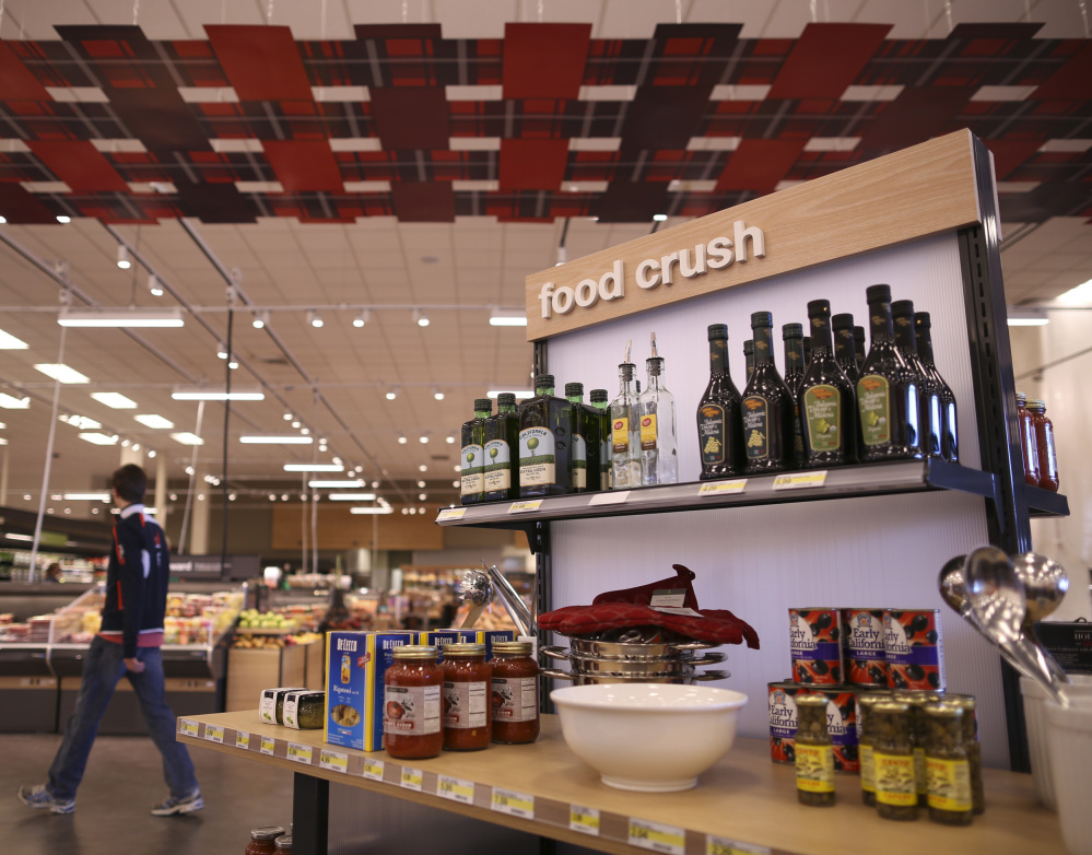 Kiosks like this one in a renovated Minnesota store aim to inspire shoppers. The areas display related food items as well as bowls and sleek place mats.