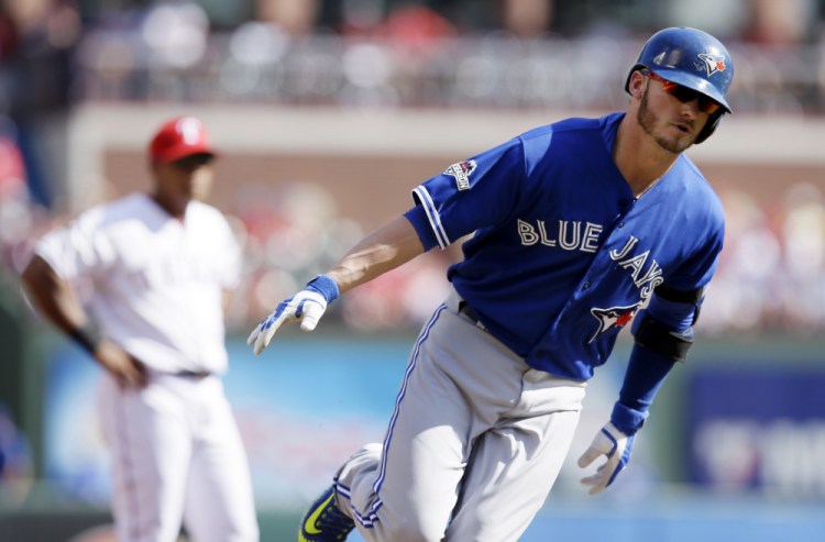 Toronto third baseman Josh Donaldson rounds the bases after hitting a two-run home run in the first inning, starting a run in which the Blue Jays took a 7-0 lead by the third inning.