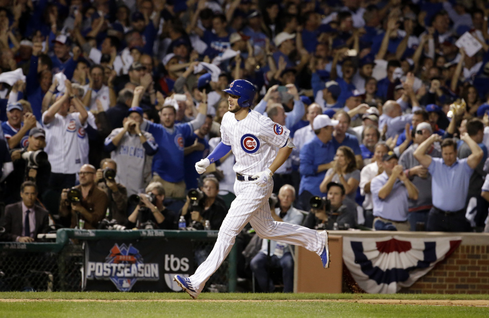 Cubs third baseman Kris Bryant runs the bases after hitting a two-run home run in the fifth inning. It was the third of six home runs by Chicago as the Cubs took a 2-1 lead in the series.