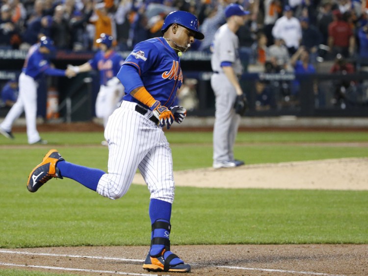 The Mets’ Yoenis Cespedes trots down the first base line after hitting a three-run home run off Dodgers pitcher Alex Wood in the fourth inning of Monday night’s game in New York.