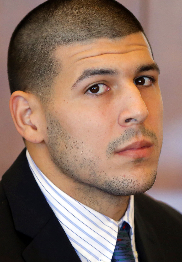 Former New England Patriots NFL football player Aaron Hernandez attends a pretrial court hearing in Fall River, Mass. on Wednesday, Oct. 9, 2013. Hernandez was indicted in August in the killing of 27-year-old Odin Lloyd, a semi-professional football player from Boston who was dating the sister of Hernandez's girlfriend. He has pleaded not guilty. (AP Photo/Brian Snyder, Pool)