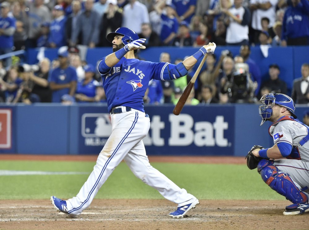 The Blue Jays’ Jose Bautista connects for a three-run home run in the seventh inning Wednesday. The shot helped Toronto to a series-clinching 6-3 win.