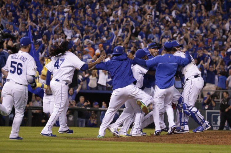 The Royals celebrate their 7-2 win over the Houston Astros in Game 5 their American League Division Series.