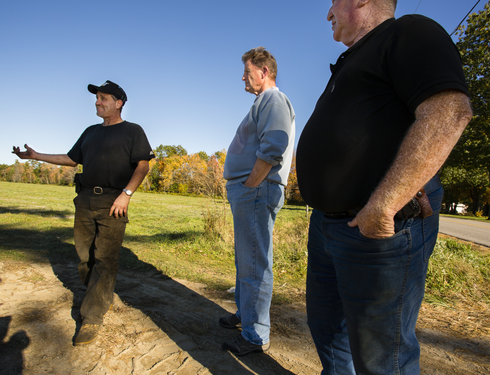 Rick Dubois, owner of Dubois Livestock & Excavating, talks about the company’s compost-spreading operation. Sol Fedder, center, a company director, said the compost has been cured to reduce the odor. At right is Rick Dubois' father, Marcel Dubois.