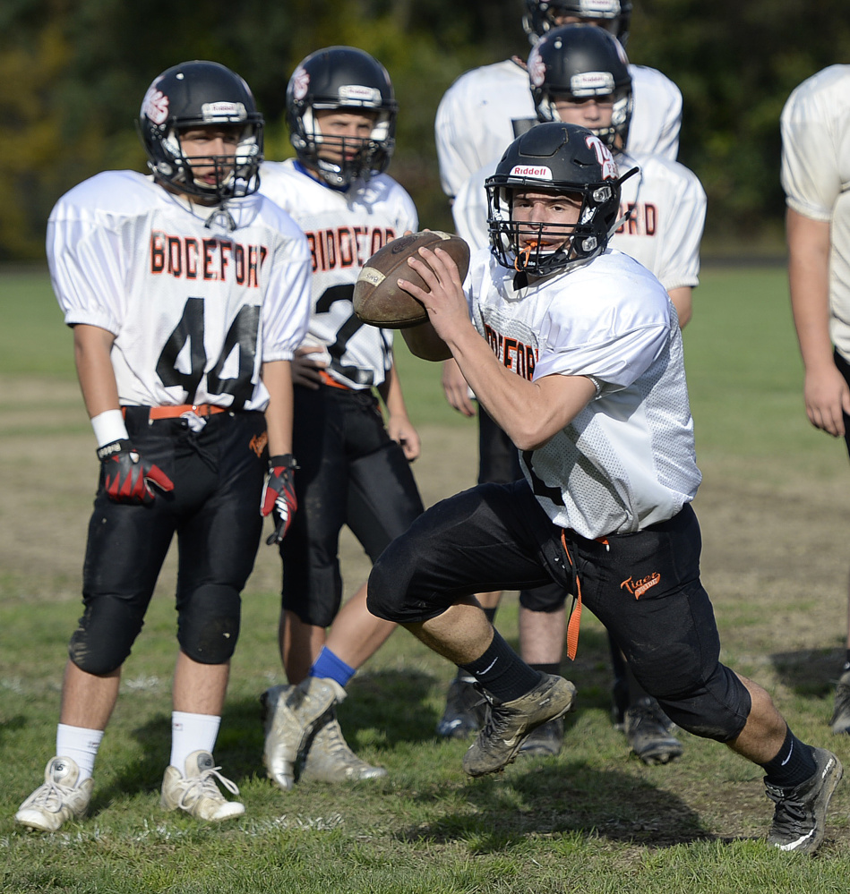 Joey Curit of Biddeford handles the ball during a fake field goal drill. “When you’re not solid (on special teams), you make mistakes that can come back to haunt you,” says Westbrook Coach Jeff Guerrette.