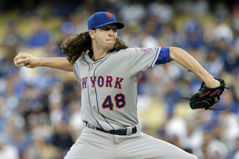 Mets starting pitcher Jacob deGrom works against the Dodgers in the first inning. DeGrom got his second win of the series, holding the Dodgers to two runs on six hits in six innings.