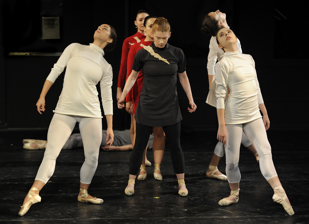 Portland Ballet dancers rehearse for “Three Tales by Poe.” “Investigators,” in white from left, are Kaleigh Natale, Annie Moore and Erica Diesel; “Narrator,” center, is Kaitlyn Hayes; and “Heartbeats,” in red, are Amelia Bielen and Deborah Grammatic.