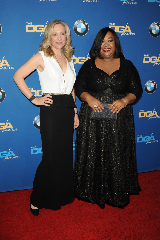 Betsy Beers, left, and Shonda Rhimes at an awards ceremony in 2014. Beers is executive producer for all of Rhimes’ series, including the hits “Grey’s Anatomy,” “Scandal” and “How to Get Away with Murder.”