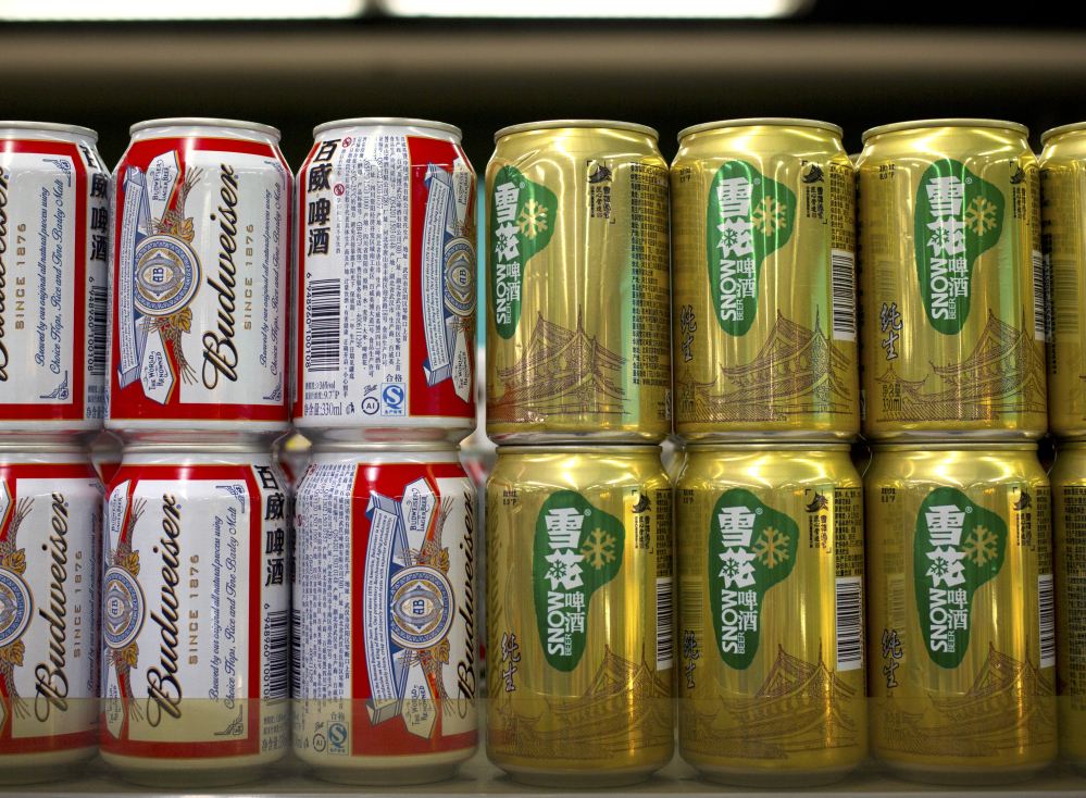 The maker of Budweiser could soon hold a 49 percent stake in Snow, the cans on the right.