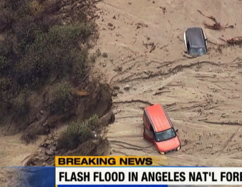 This image made from video provided by KABC-TV shows cars caught in mud in Lake Hughes, Calif., after torrential rains Thursday caused mudslides.