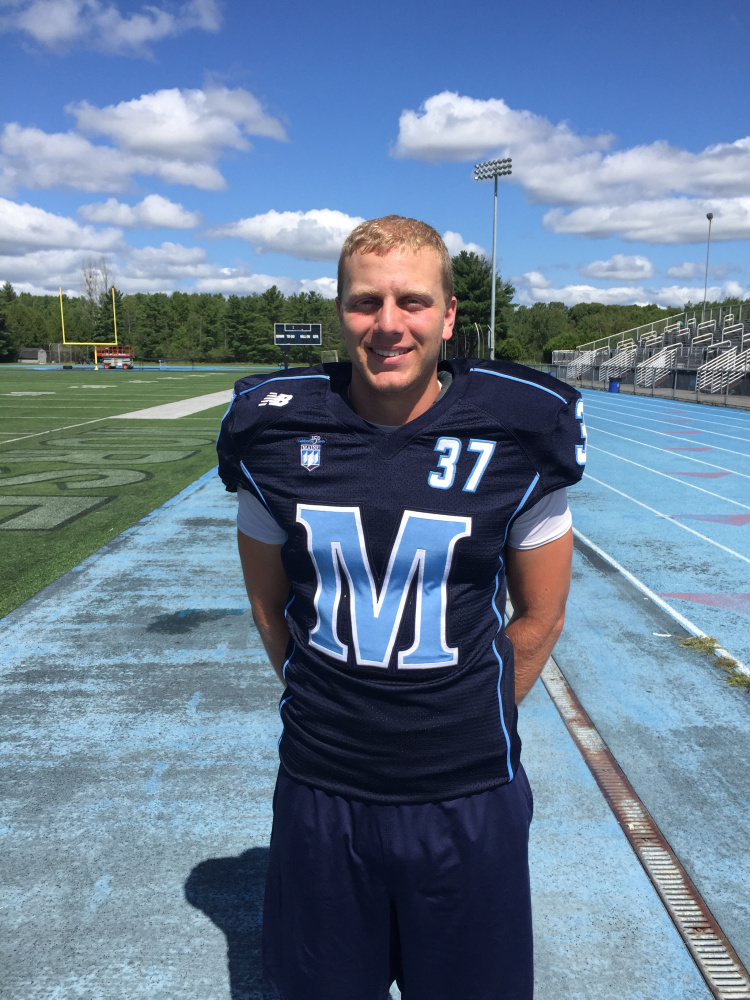 Kicker Sean Decloux shows off the uniform the University of Maine will be wearing Saturday against Yale – a long-ago national power playing in Orono for the first time. Mark Emmert/Staff Writer